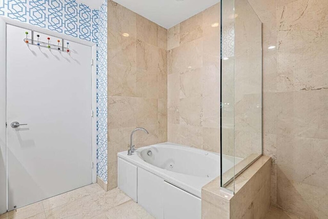 bathroom with tile walls and a bathing tub