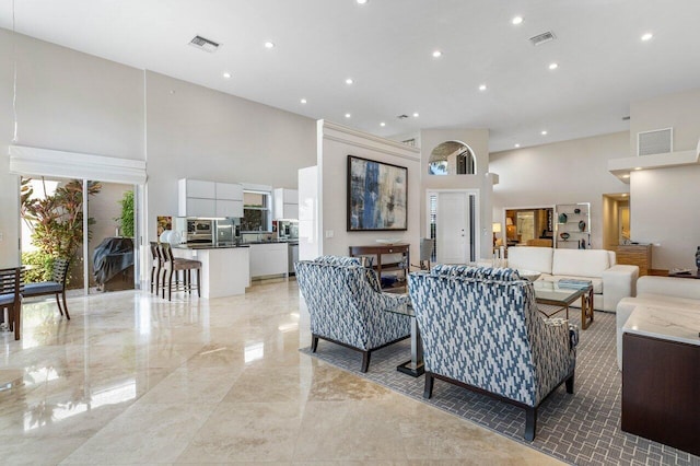 living room with a high ceiling