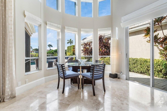 sunroom / solarium featuring a healthy amount of sunlight