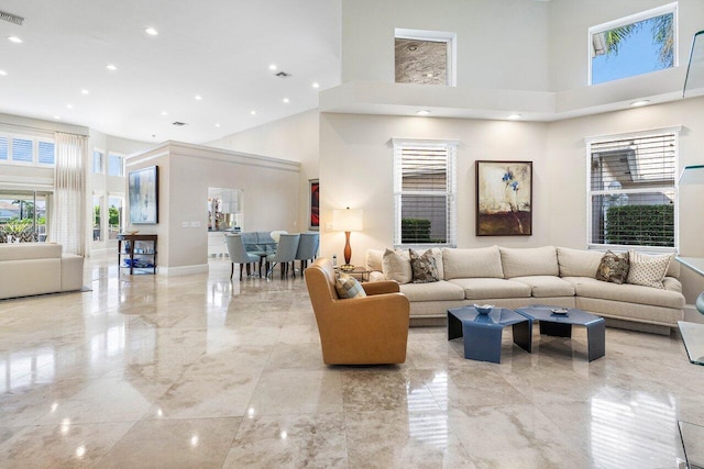 living room with a towering ceiling