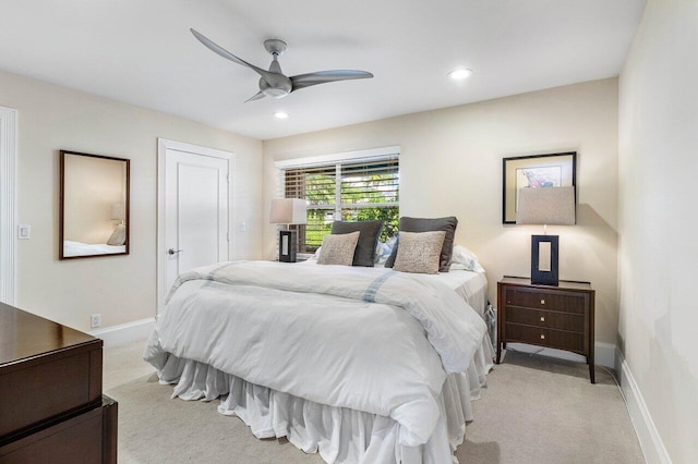 bedroom featuring light carpet and ceiling fan