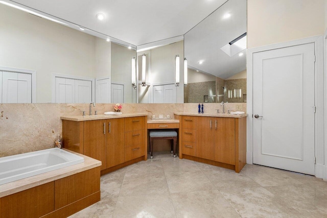 bathroom featuring tile patterned flooring, vanity, independent shower and bath, and high vaulted ceiling