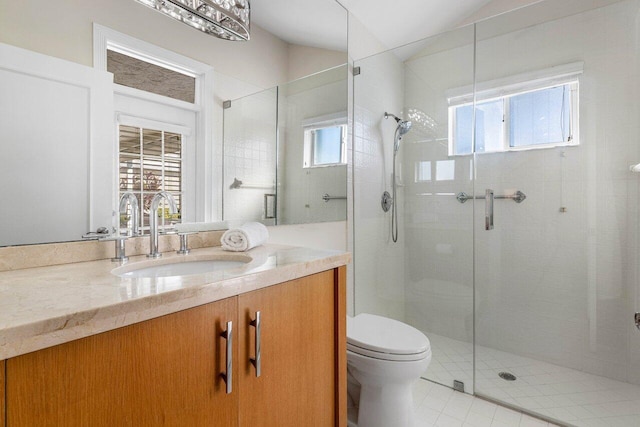 bathroom with tile patterned flooring, plenty of natural light, and vanity