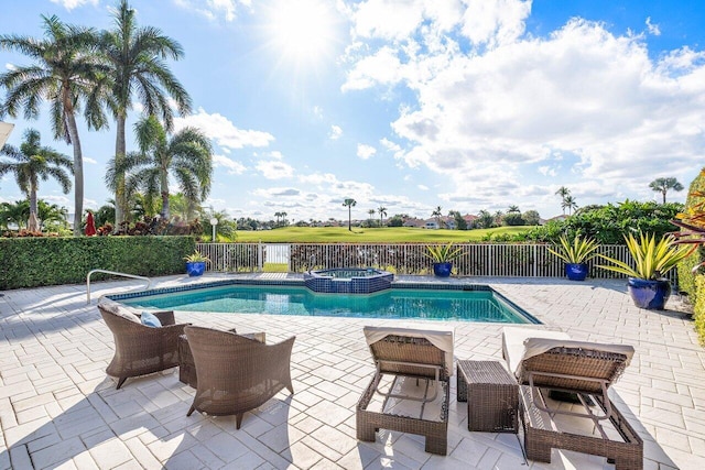 view of pool with an in ground hot tub and a patio area