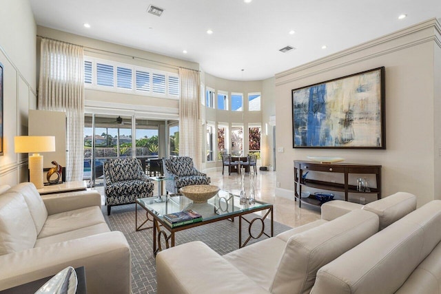 living room with a towering ceiling