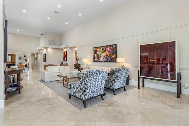 living room with a high ceiling