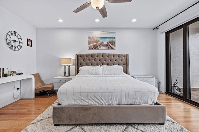 bedroom with access to outside, light hardwood / wood-style flooring, and ceiling fan