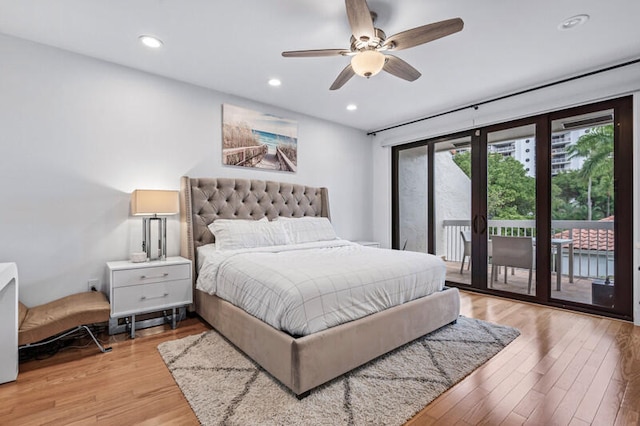 bedroom featuring access to exterior, french doors, light hardwood / wood-style floors, and ceiling fan