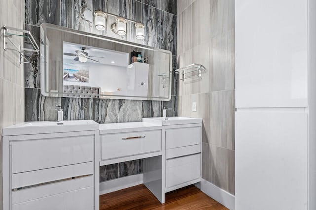 bathroom featuring ceiling fan, vanity, and hardwood / wood-style flooring