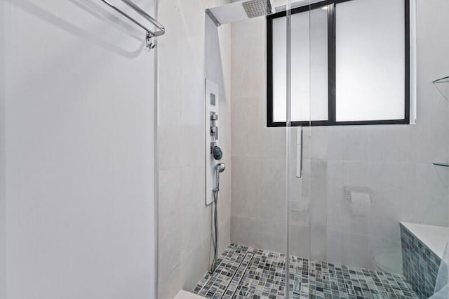 bathroom with toilet and walk in shower