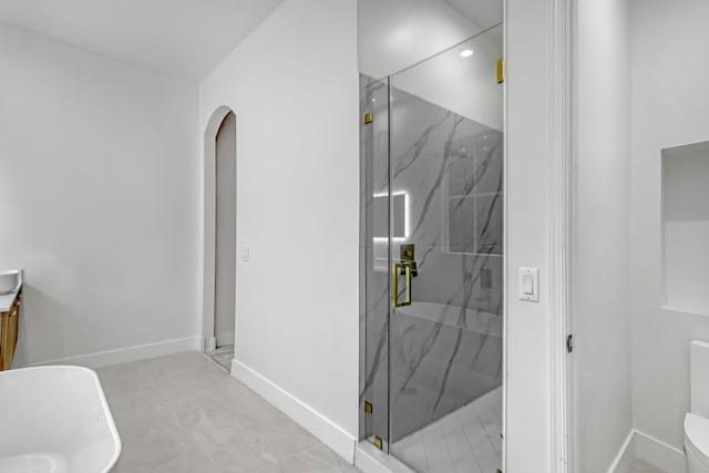 bathroom with tile patterned flooring and plus walk in shower