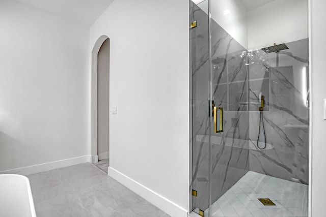 bathroom with a shower with shower door