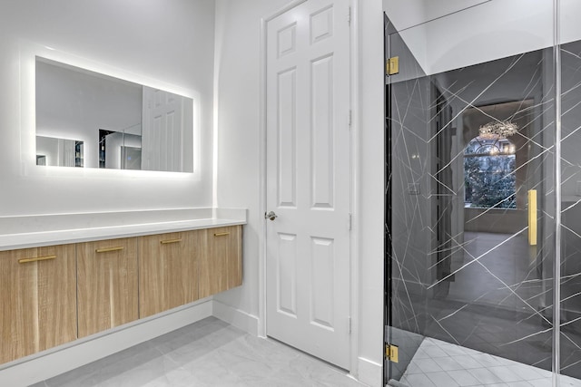 bathroom with vanity and an enclosed shower