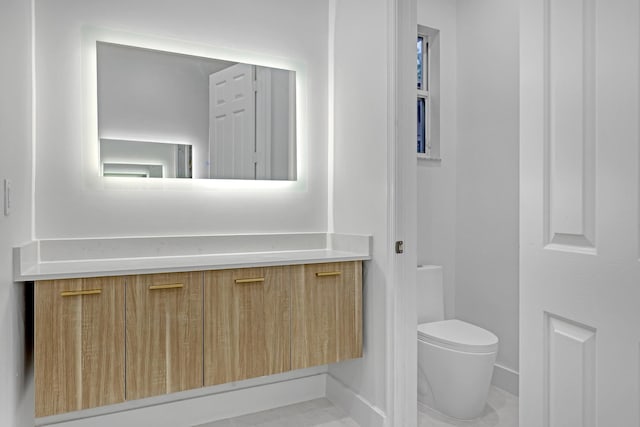 bathroom featuring tile patterned floors and toilet