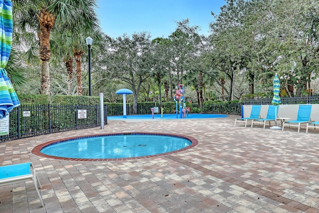 view of swimming pool with a patio area