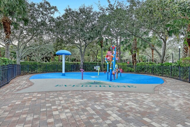 view of swimming pool featuring a playground