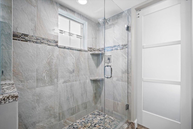 full bath with a shower stall