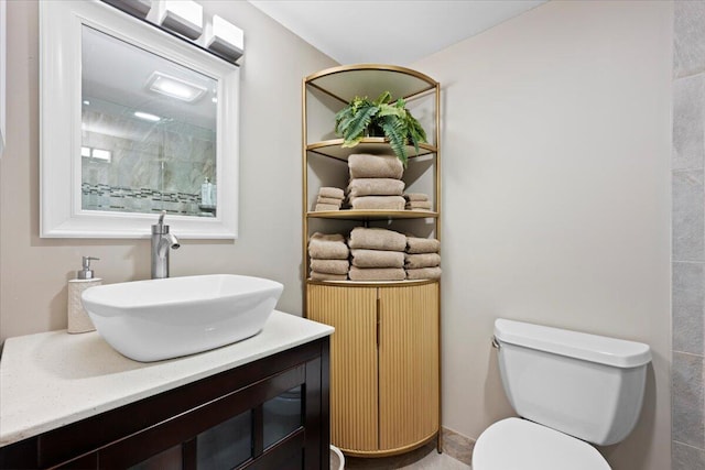 full bath featuring vanity, toilet, and a shower