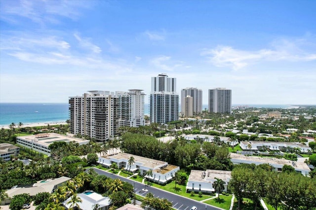 birds eye view of property with a view of city and a water view