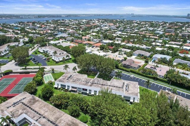 birds eye view of property with a residential view and a water view