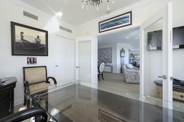 office space with french doors and crown molding