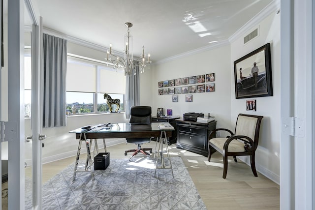 office with a notable chandelier, light wood-type flooring, and ornamental molding