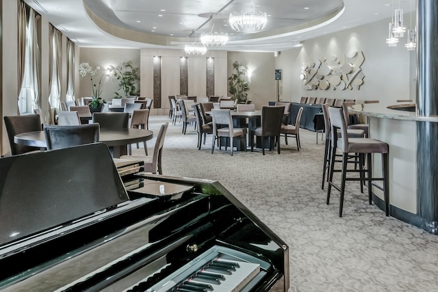 3610 Gardens Pkwy Unit 503A, Palm Beach Gardens, FL 33410 - dining room with carpet, a raised ceiling, and a chandelier