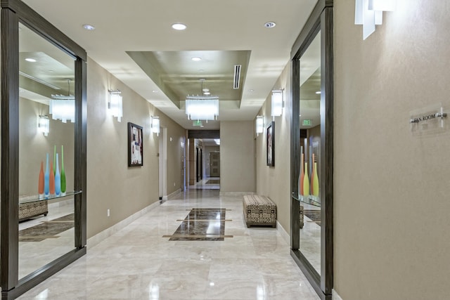 3610 Gardens Pkwy Unit 503A, Palm Beach Gardens, FL 33410 - corridor with a tray ceiling, baseboards, recessed lighting, and marble tiled floors