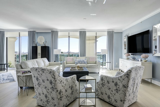 3610 Gardens Pkwy Unit 503A, Palm Beach Gardens, FL 33410 - living area with ornamental molding, light wood-style flooring, and a wall of windows
