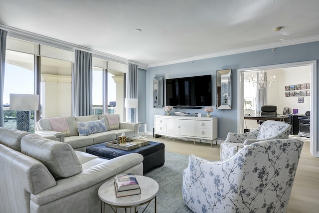 living room featuring a wealth of natural light, light hardwood / wood-style floors, and ornamental molding