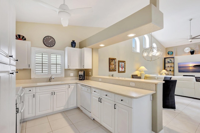 kitchen featuring kitchen peninsula, white cabinetry, sink, and white appliances