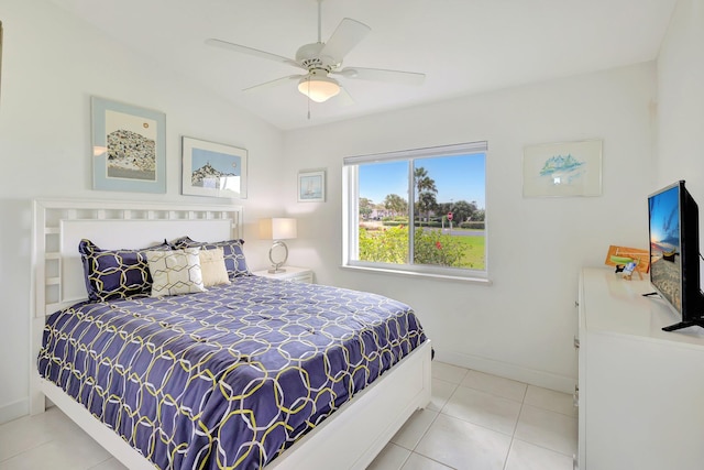 tiled bedroom featuring ceiling fan and lofted ceiling