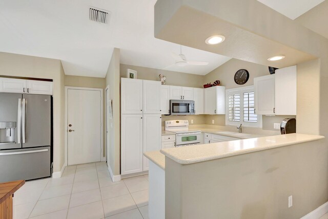 dining space featuring a notable chandelier, a healthy amount of sunlight, and light tile patterned floors