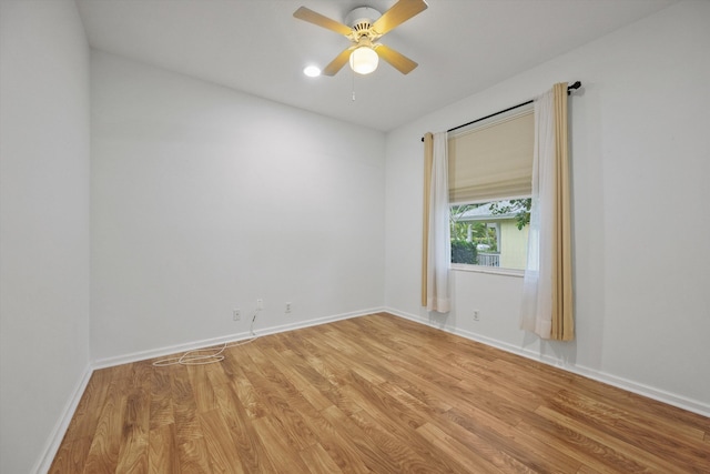 unfurnished room with light hardwood / wood-style floors and ceiling fan