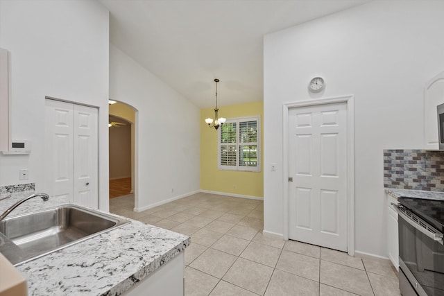 kitchen with sink, electric range, white cabinets, a chandelier, and hanging light fixtures