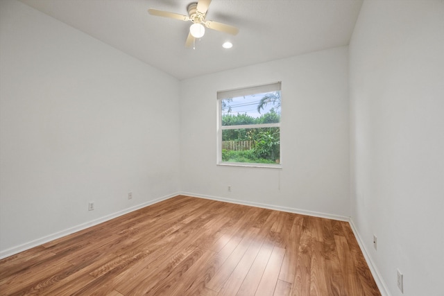 spare room featuring ceiling fan and hardwood / wood-style floors