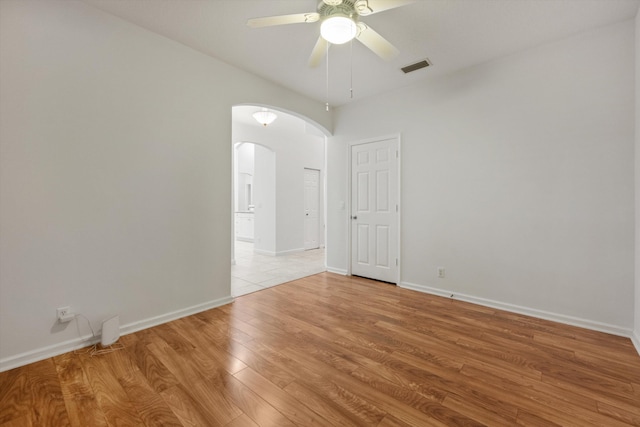 spare room featuring ceiling fan and light wood-type flooring