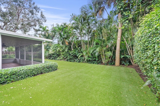 view of yard featuring a sunroom