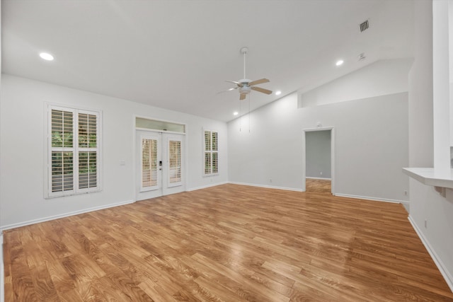 unfurnished living room featuring ceiling fan, french doors, and light hardwood / wood-style flooring