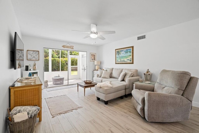 living room featuring ceiling fan and light wood-type flooring