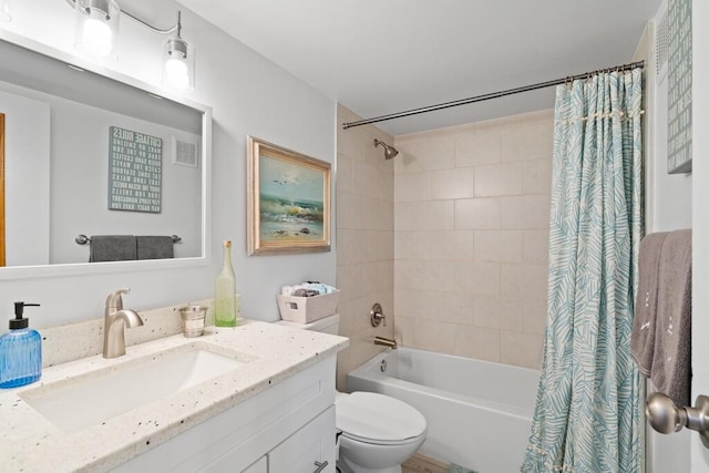 full bathroom with shower / bath combination with curtain, vanity, and toilet