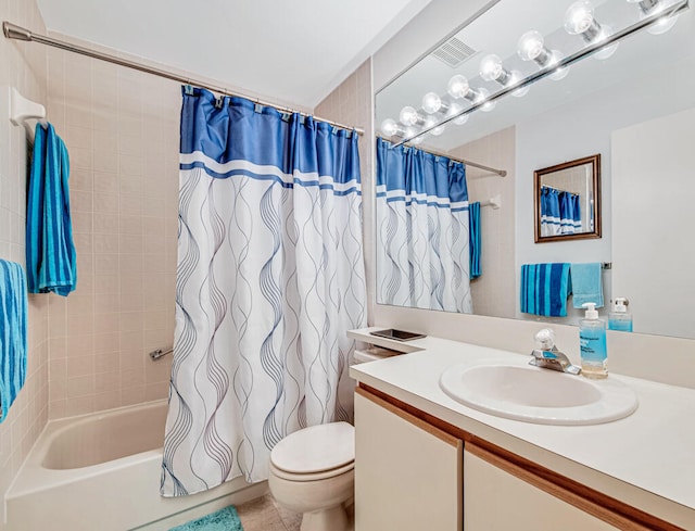 full bathroom featuring tile patterned floors, vanity, toilet, and shower / bathtub combination with curtain