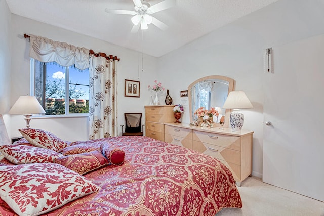 bedroom with light carpet and ceiling fan