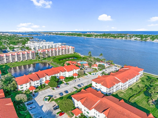 birds eye view of property with a water view