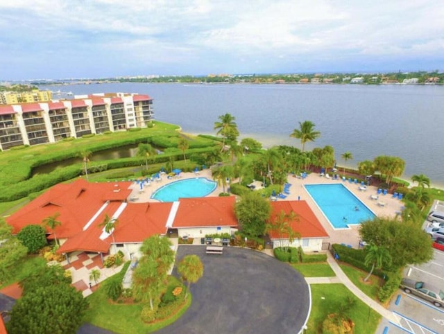 birds eye view of property with a water view