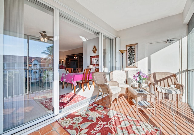 sunroom / solarium with ceiling fan