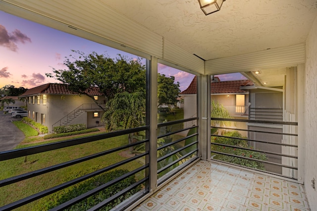 view of balcony at dusk