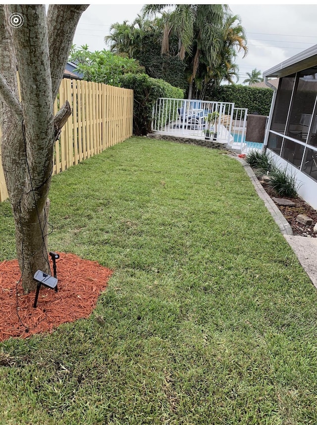 view of yard with a sunroom