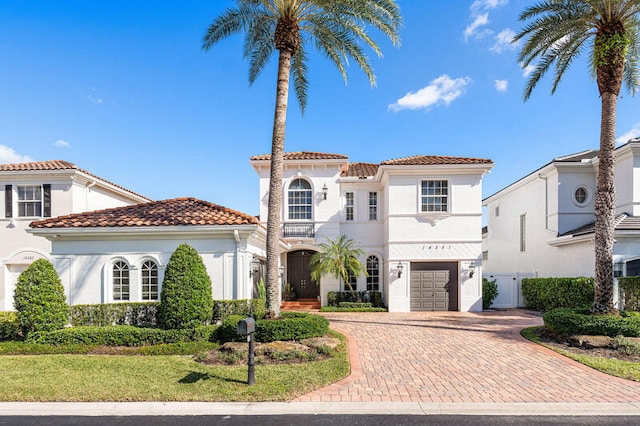 mediterranean / spanish-style home featuring a garage