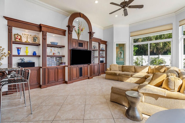 tiled living room featuring ceiling fan and crown molding